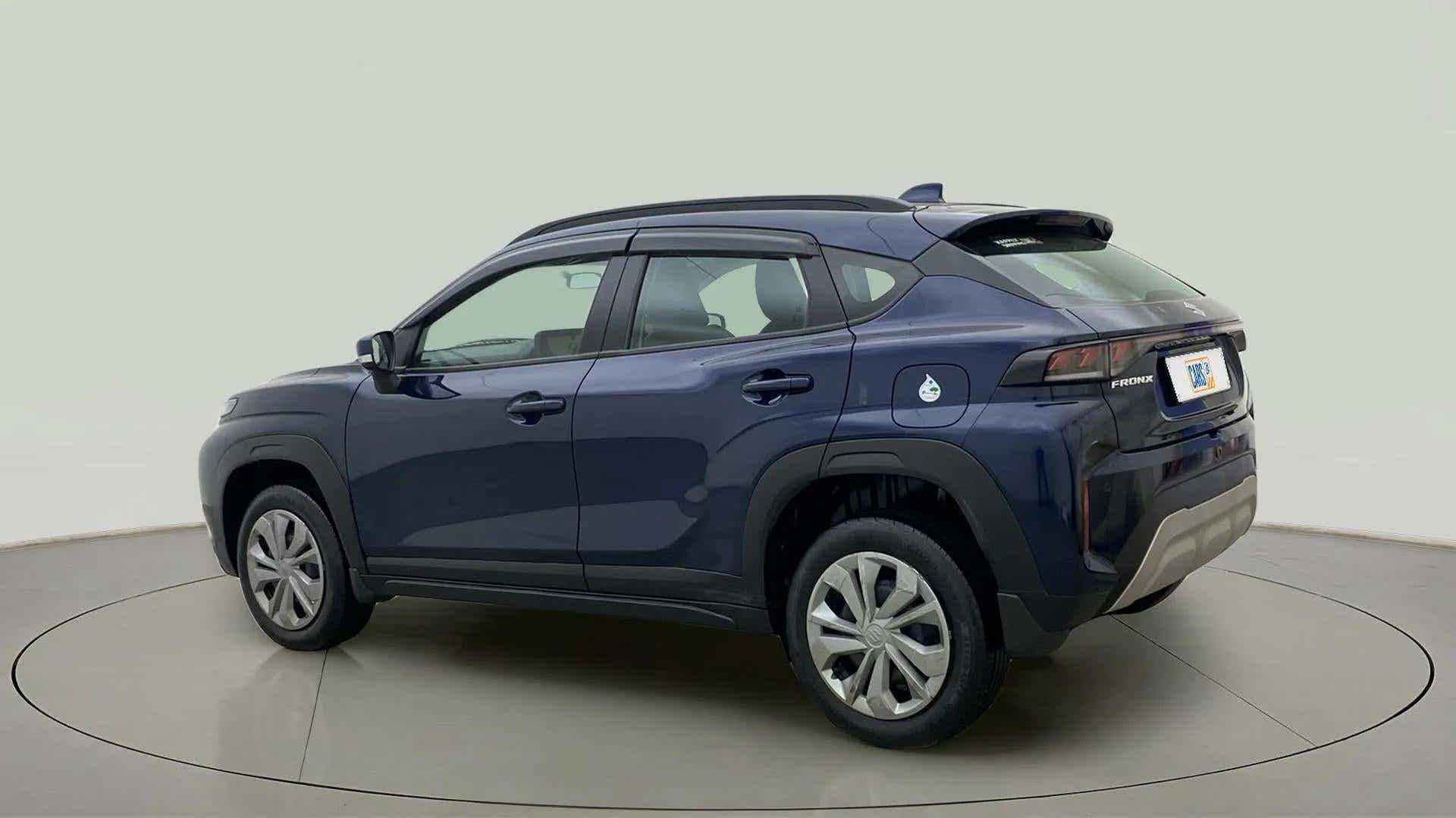 Rear three-quarter of a Nexa Blue Maruti Suzuki FRONX