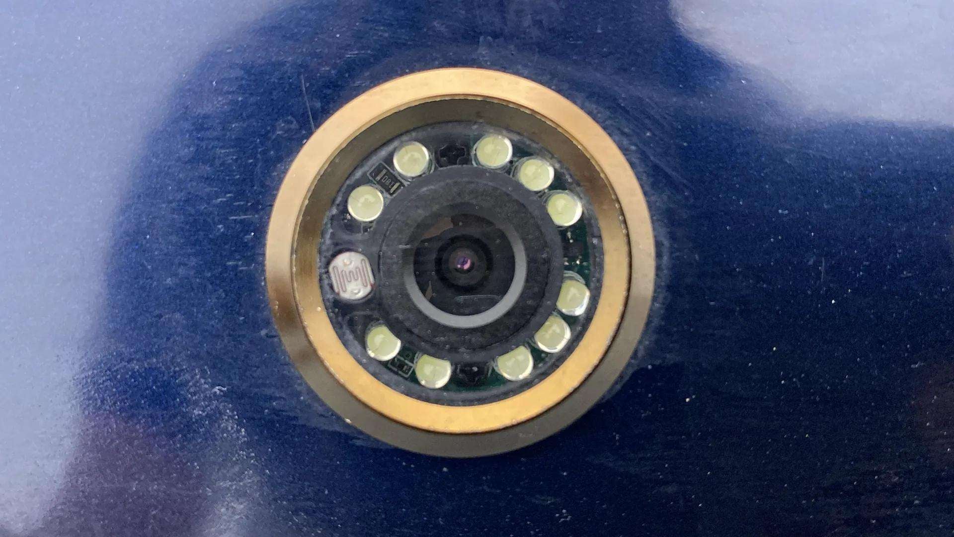 Close-up of a door peephole camera lens of a Maruti Suzuki FRONX