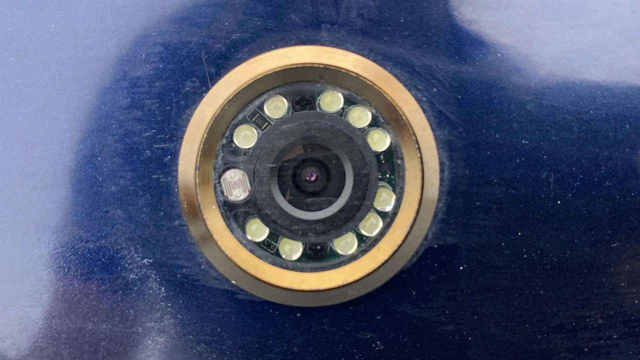 Close-up of a door peephole camera lens of a Maruti Suzuki FRONX