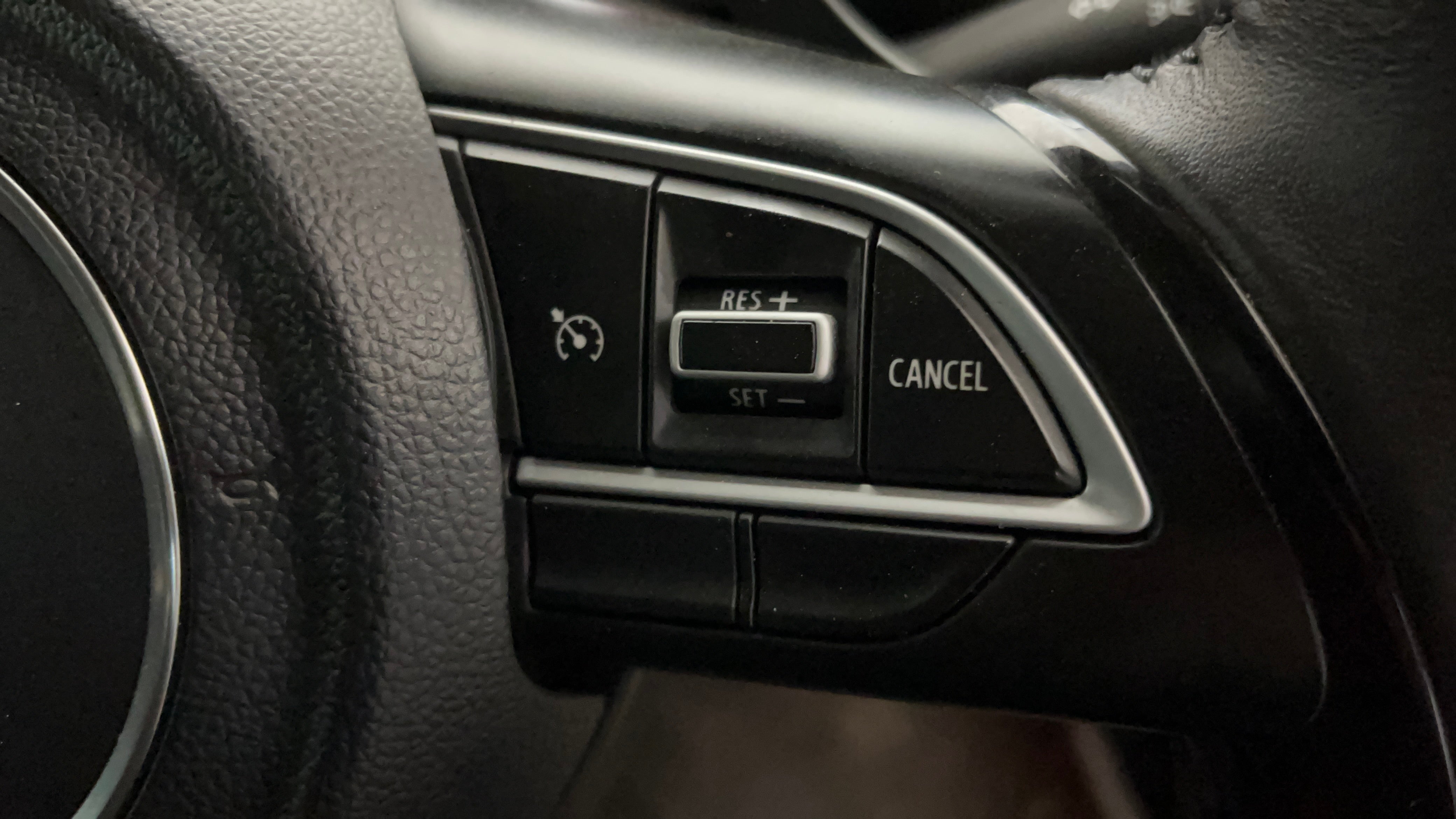 Steering wheel cruise control buttons of a Maruti Suzuki FRONX