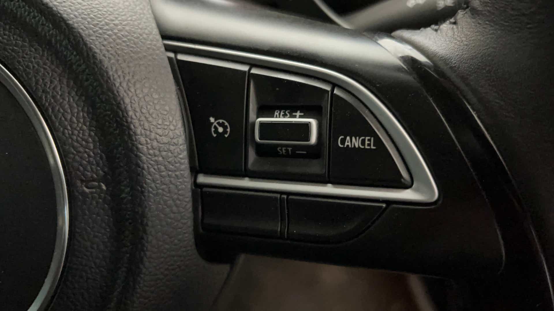 Steering wheel cruise control buttons of a Maruti Suzuki FRONX