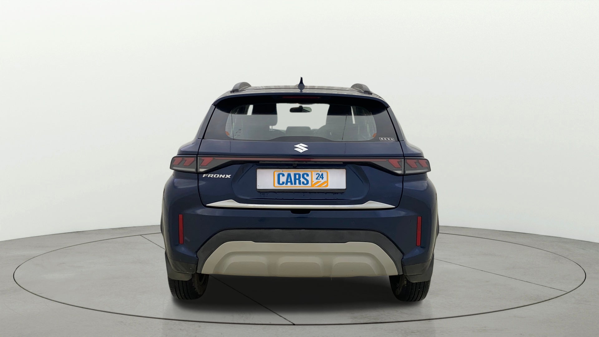 Rear view of a Nexa Blue Maruti Suzuki FRONX