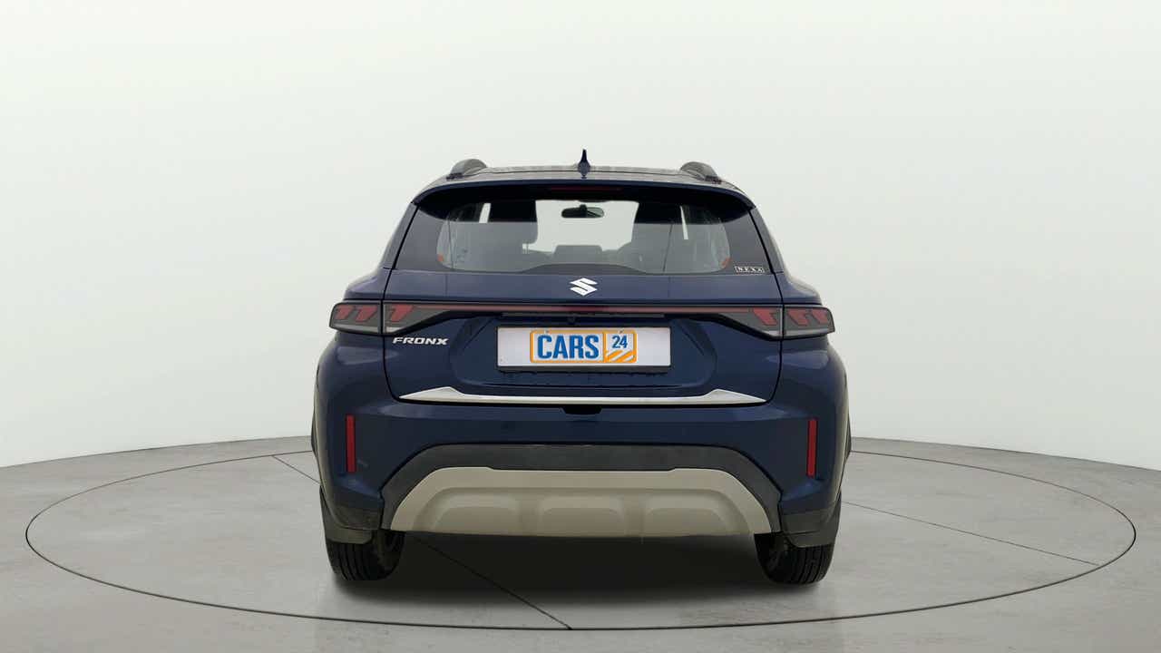 Rear view of a Nexa Blue Maruti Suzuki FRONX