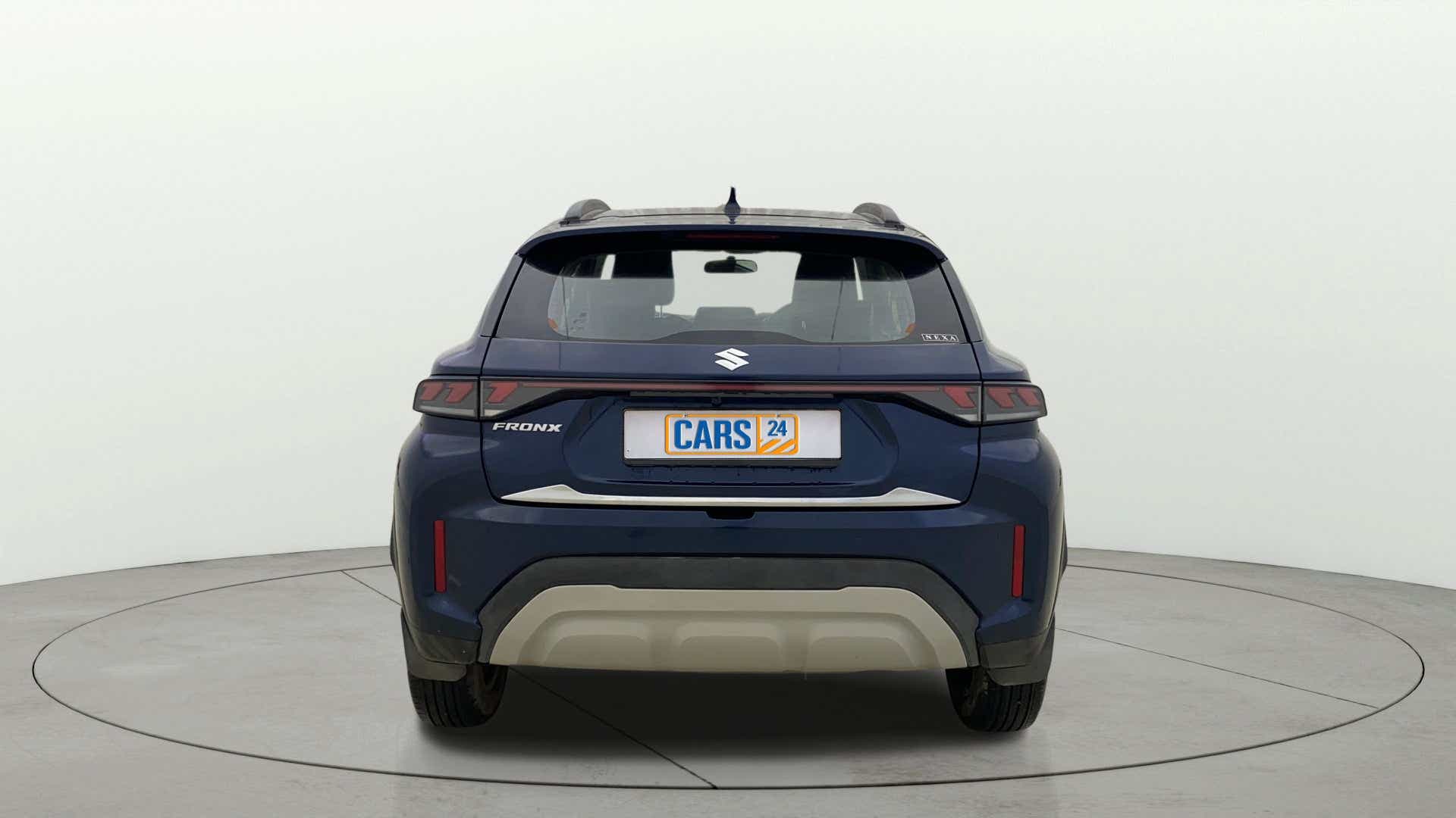 Rear view of a Nexa Blue Maruti Suzuki FRONX