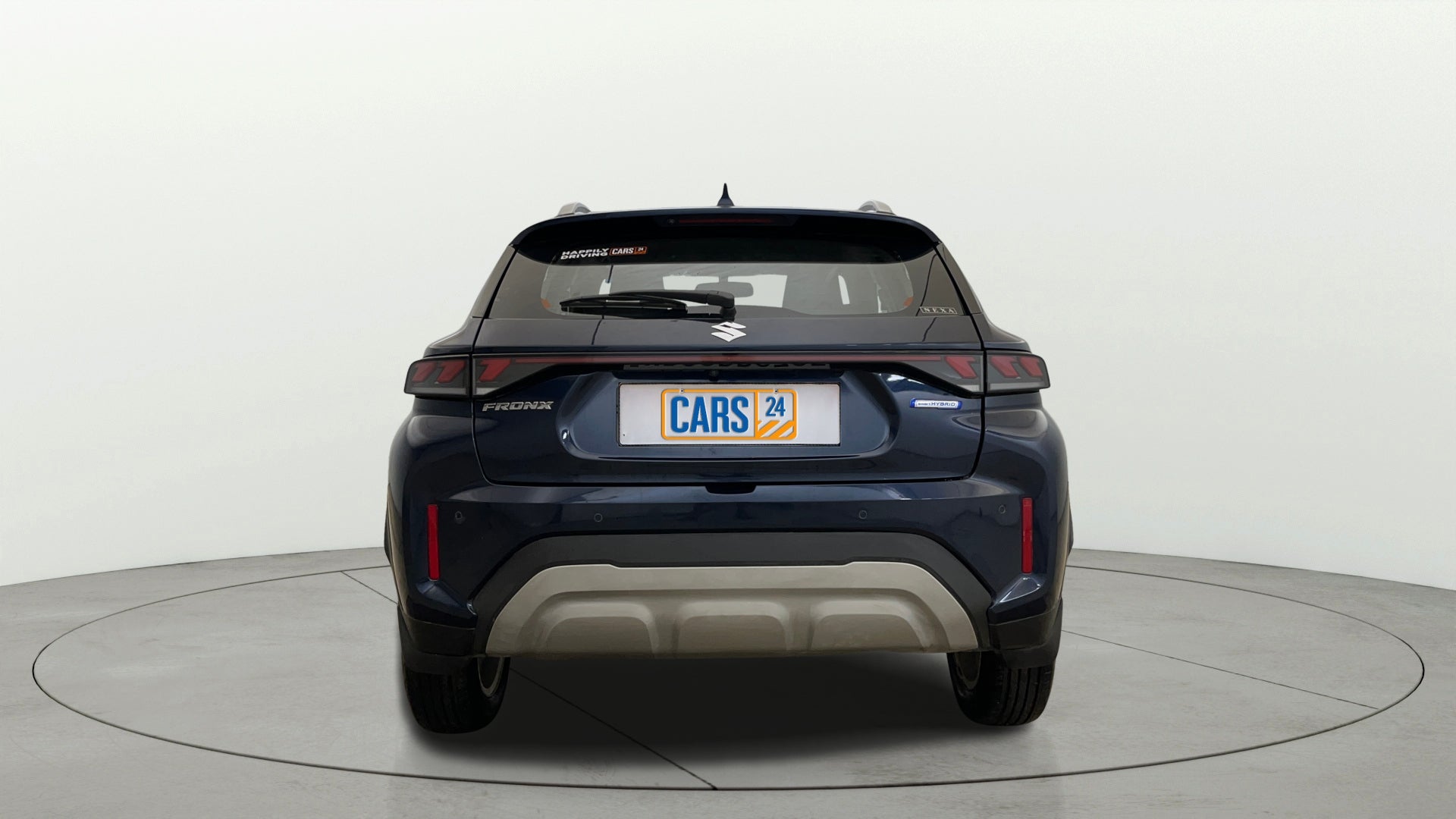 Rear view of a Nexa Blue Maruti Suzuki FRONX