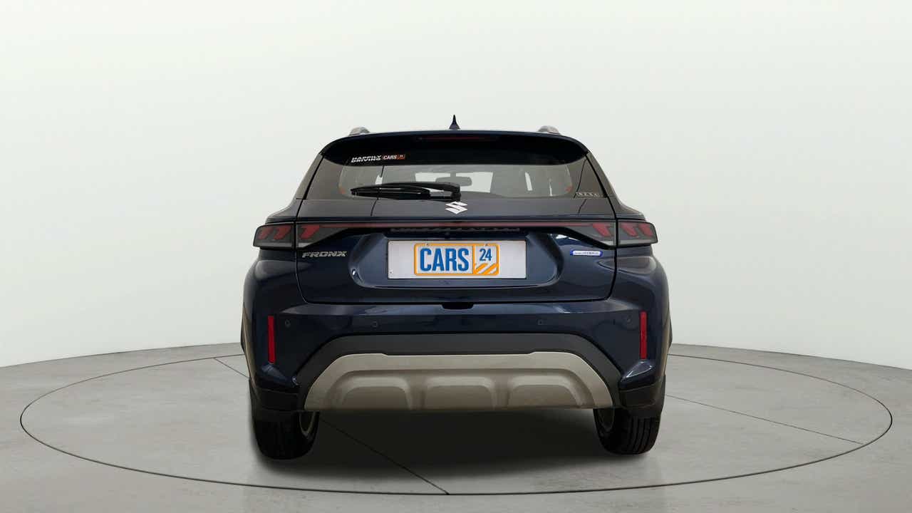 Rear view of a Nexa Blue Maruti Suzuki FRONX