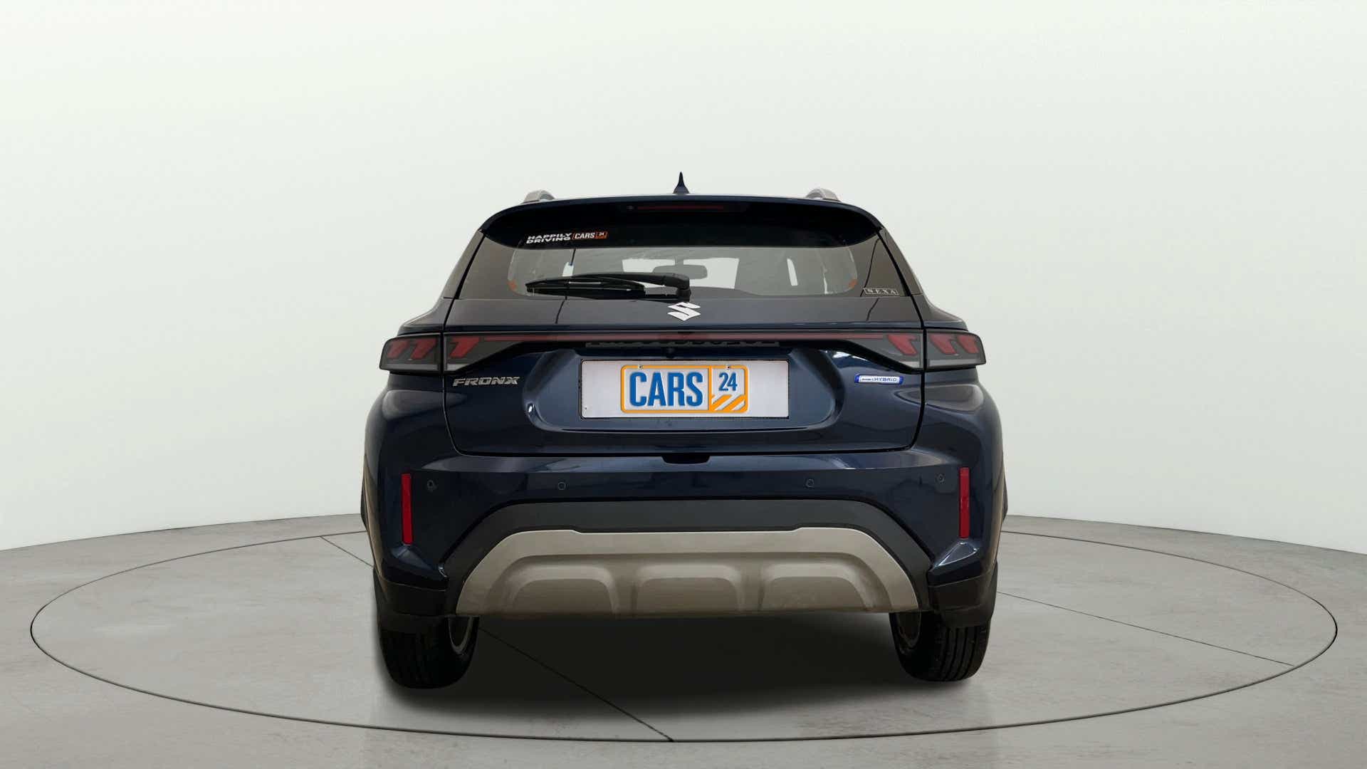 Rear view of a Nexa Blue Maruti Suzuki FRONX