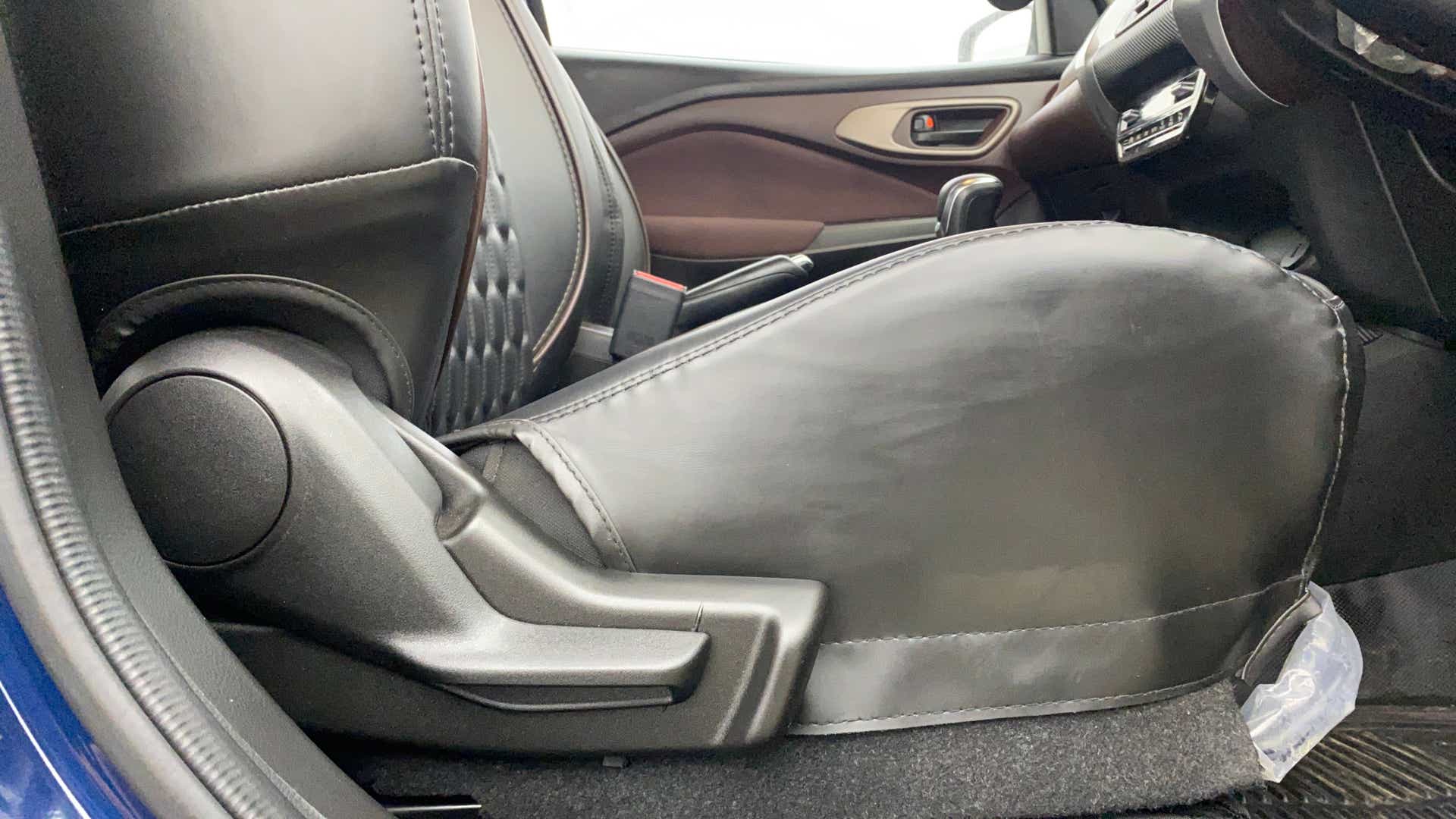Front seat and floor area of a Maruti Suzuki FRONX