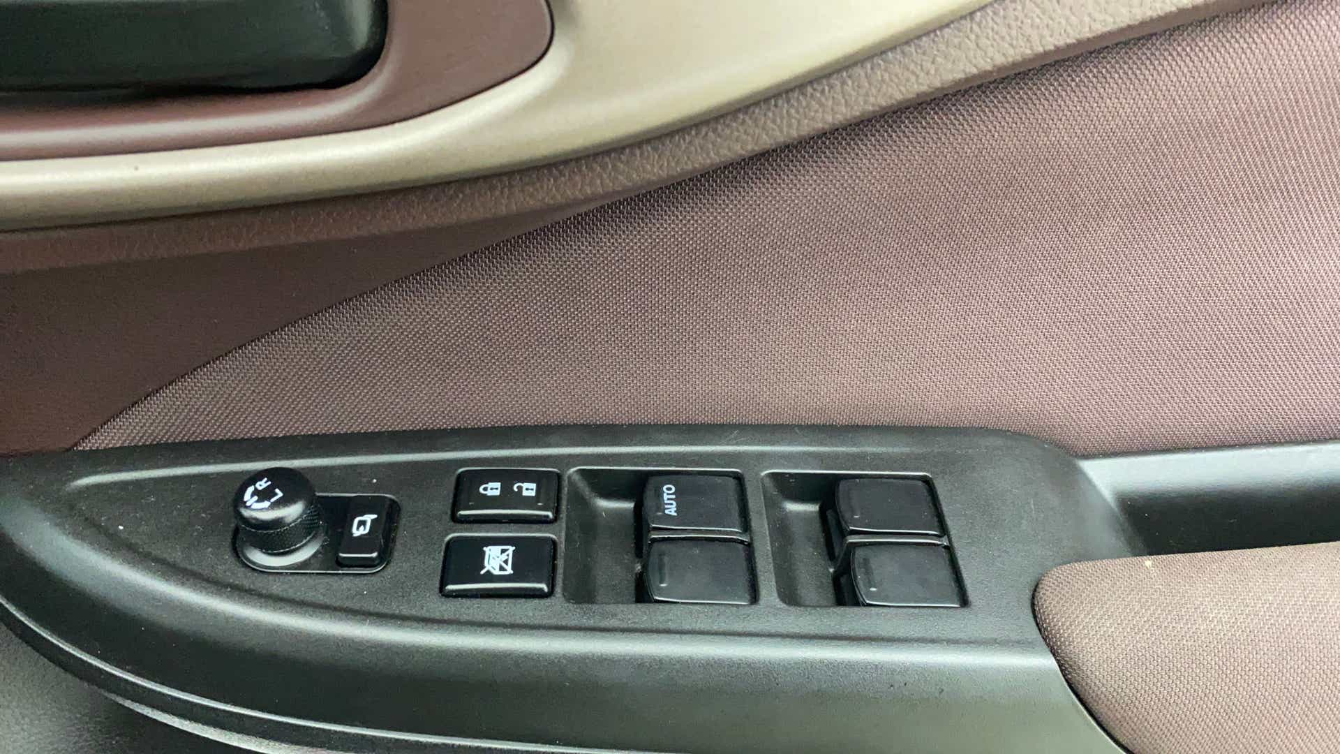 Driver side door controls of a Maruti Suzuki FRONX