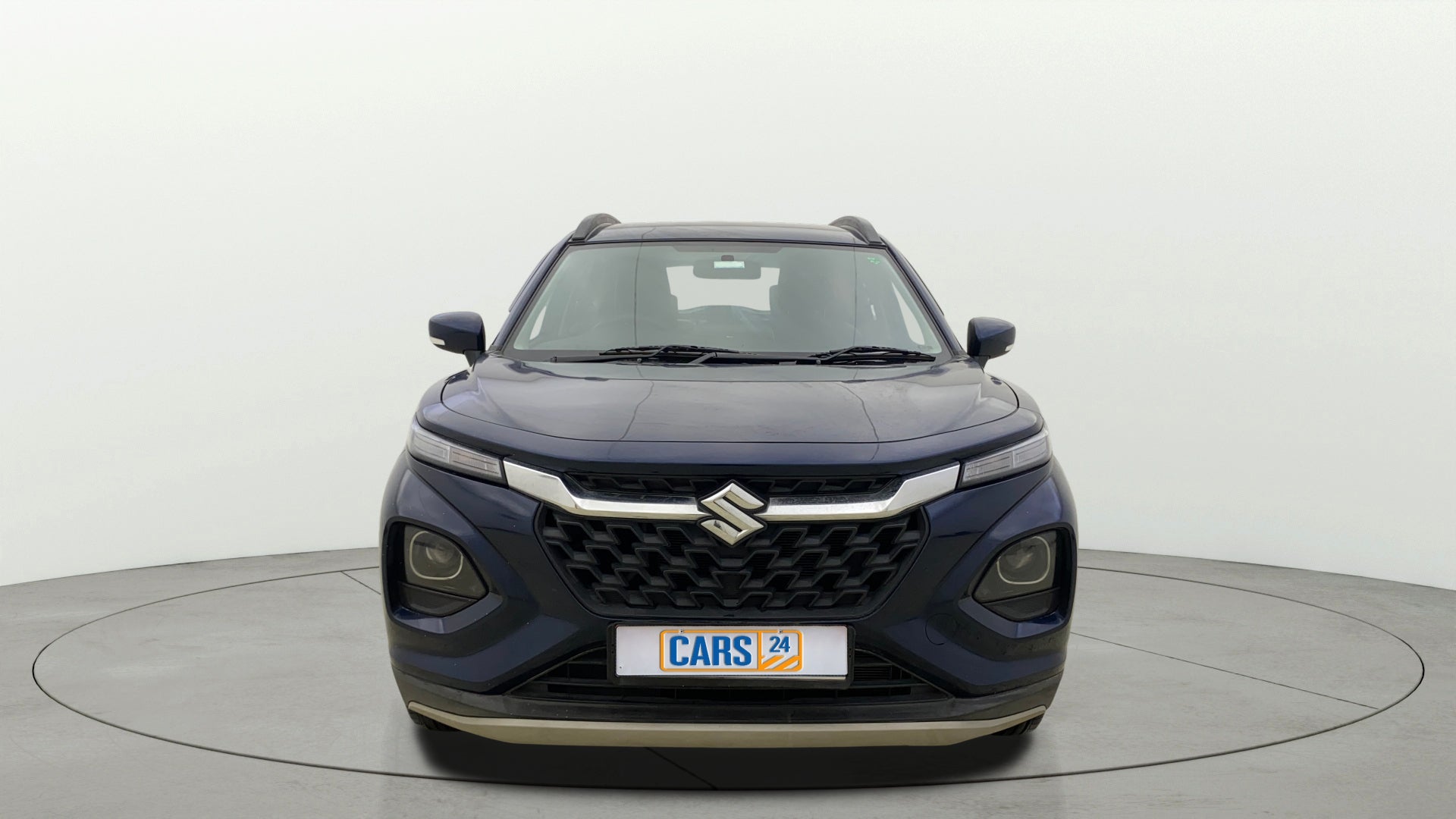 Front view of a Nexa Blue Maruti Suzuki FRONX