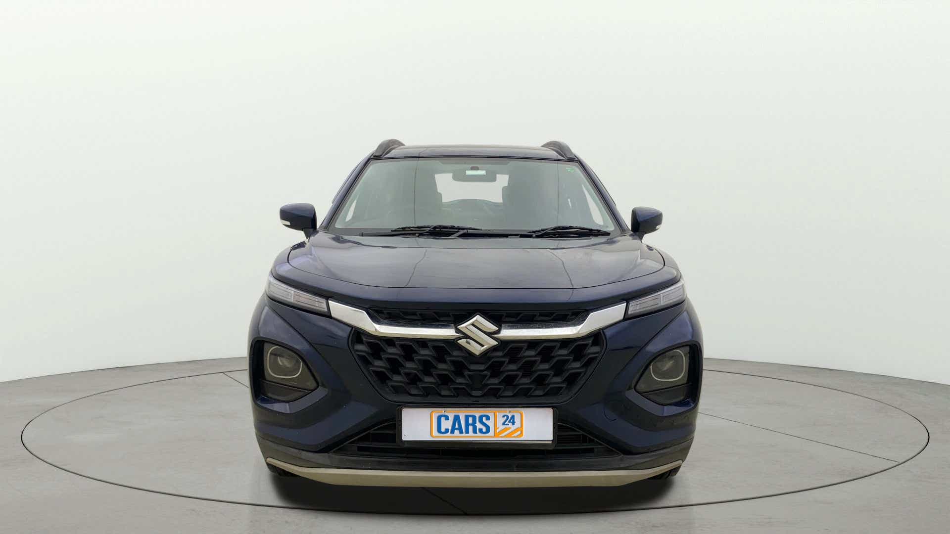 Front view of a Nexa Blue Maruti Suzuki FRONX