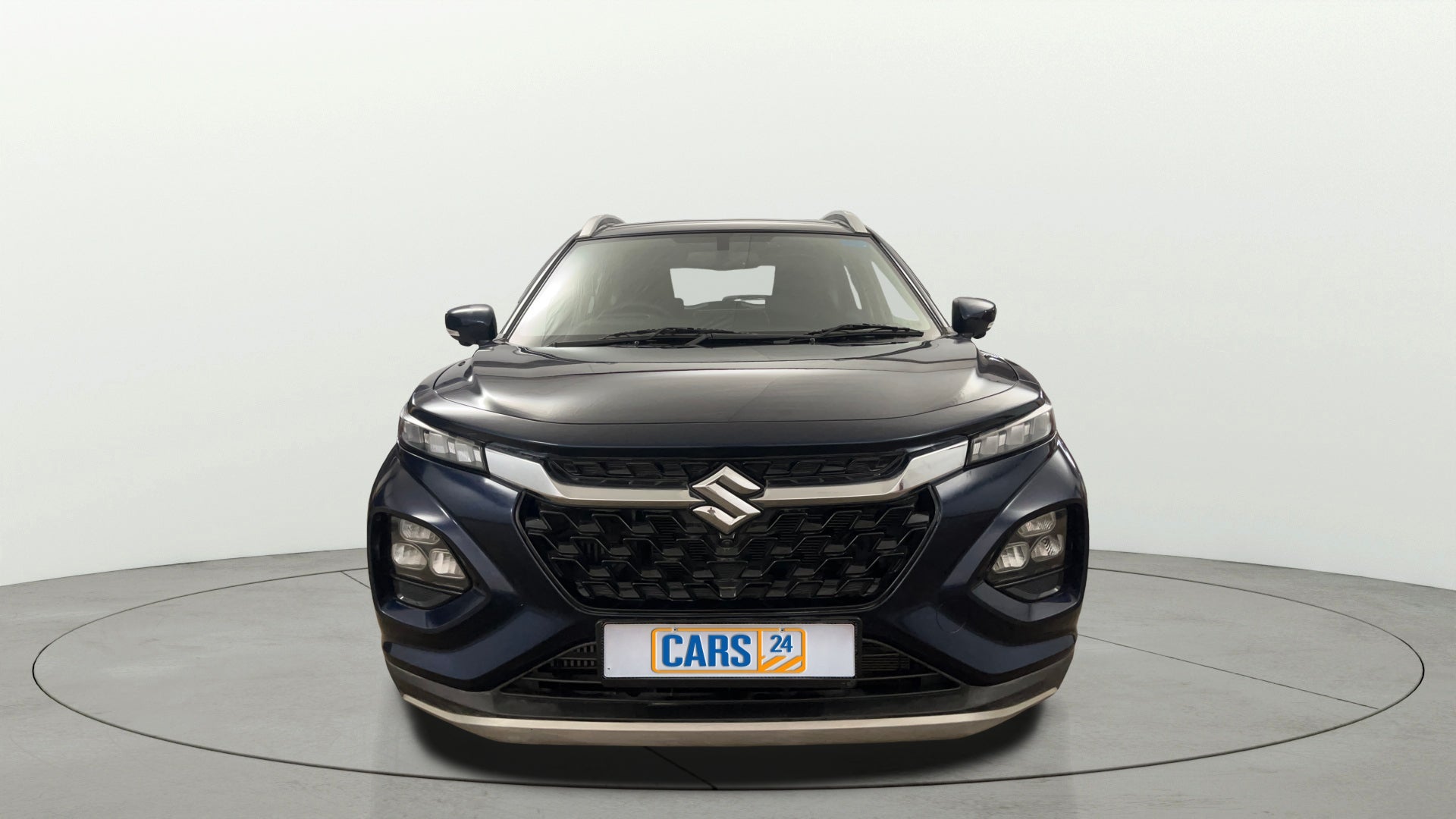 Front view of a Nexa Blue Maruti Suzuki FRONX