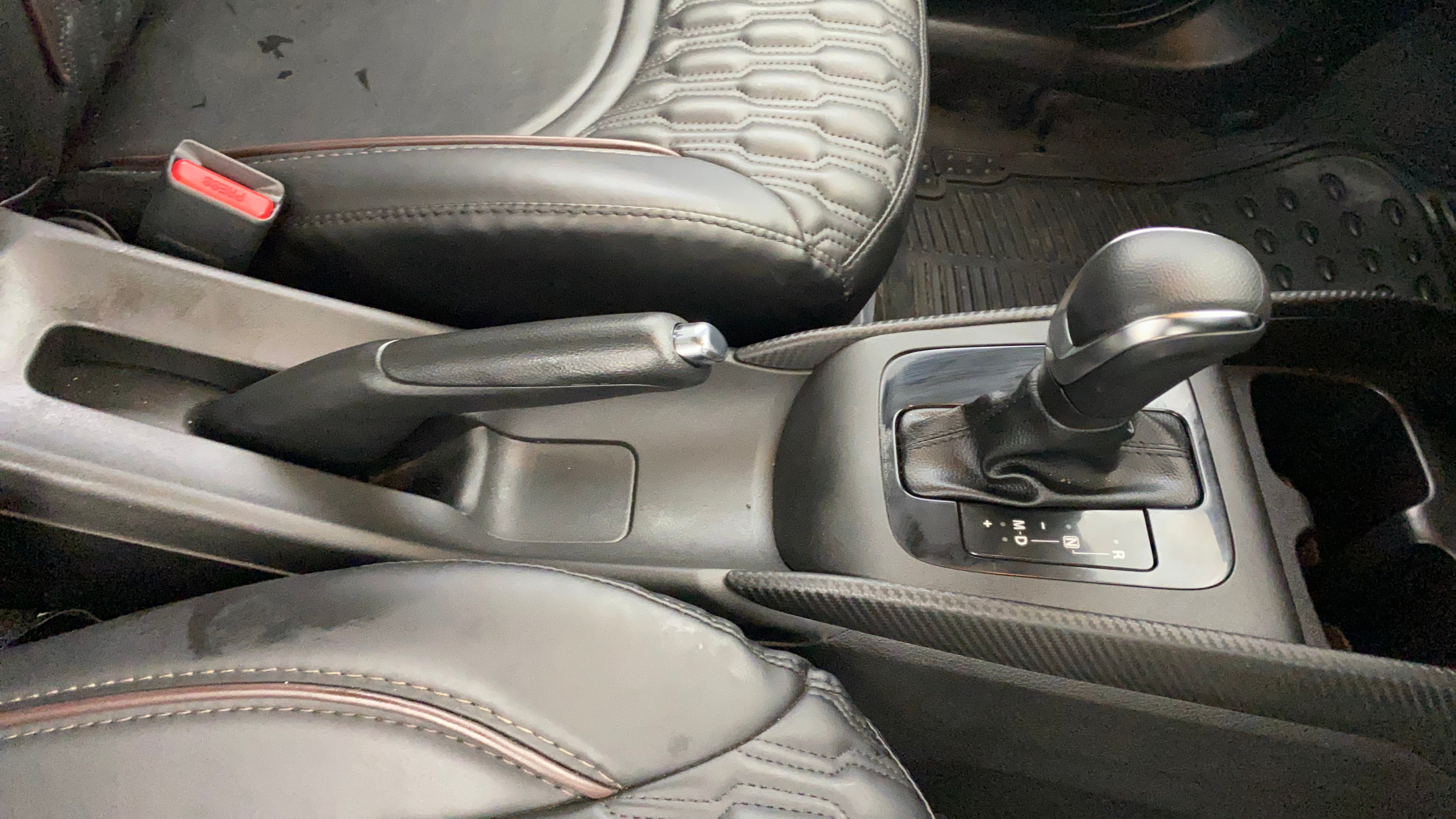 Automatic gear lever and handbrake of a Maruti Suzuki FRONX