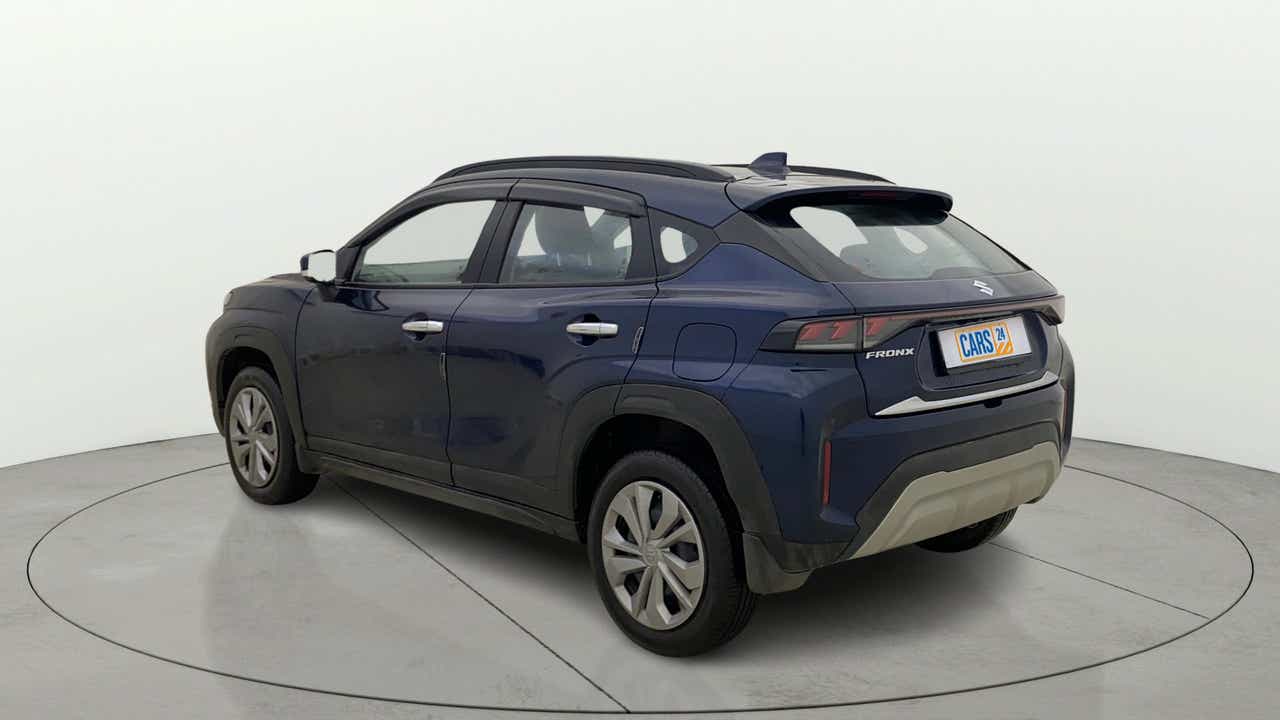 Rear three-quarter view of a Nexa Blue Maruti Suzuki FRONX