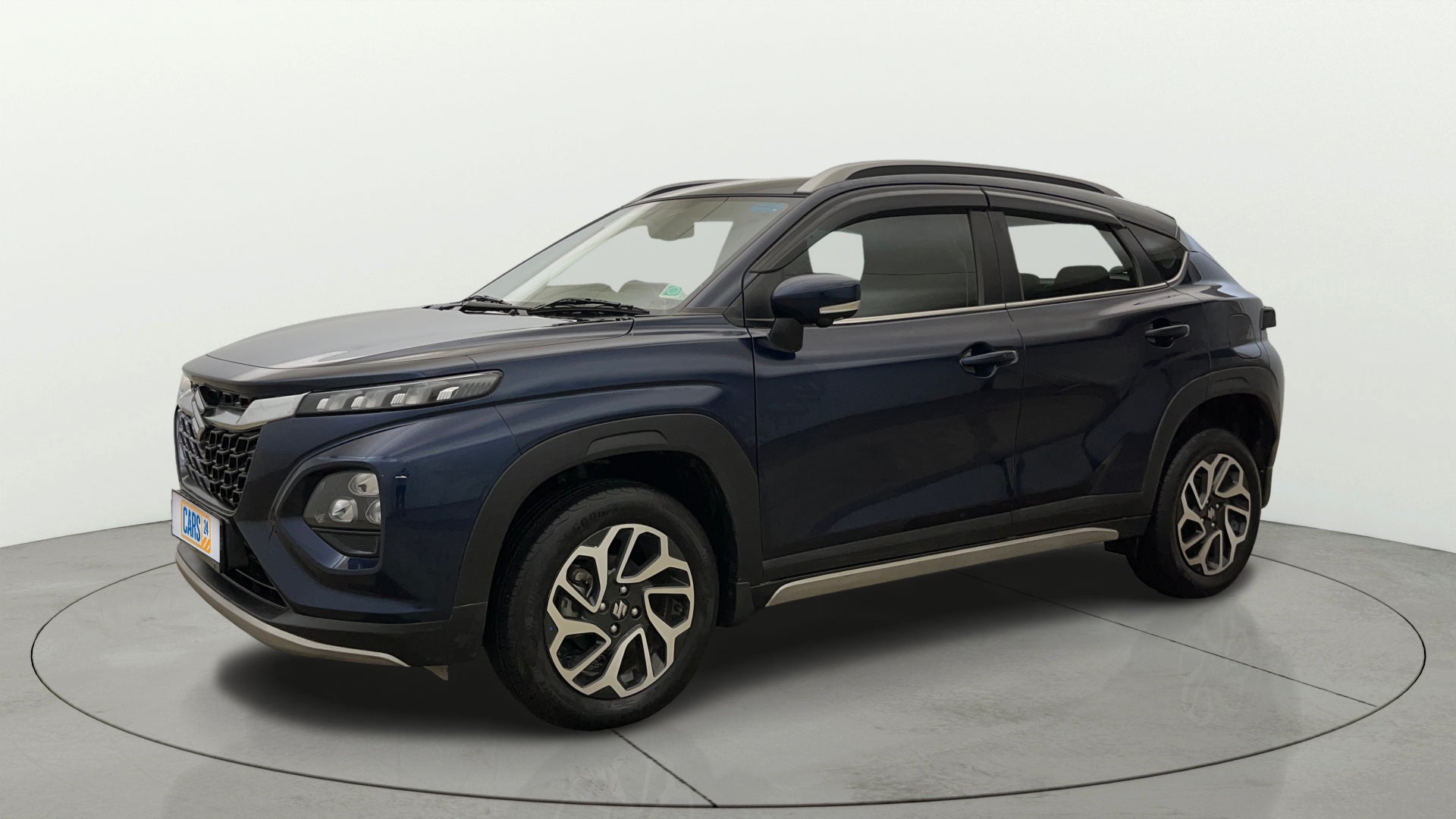 Front three-quarter view of a Nexa Blue Maruti Suzuki FRONX