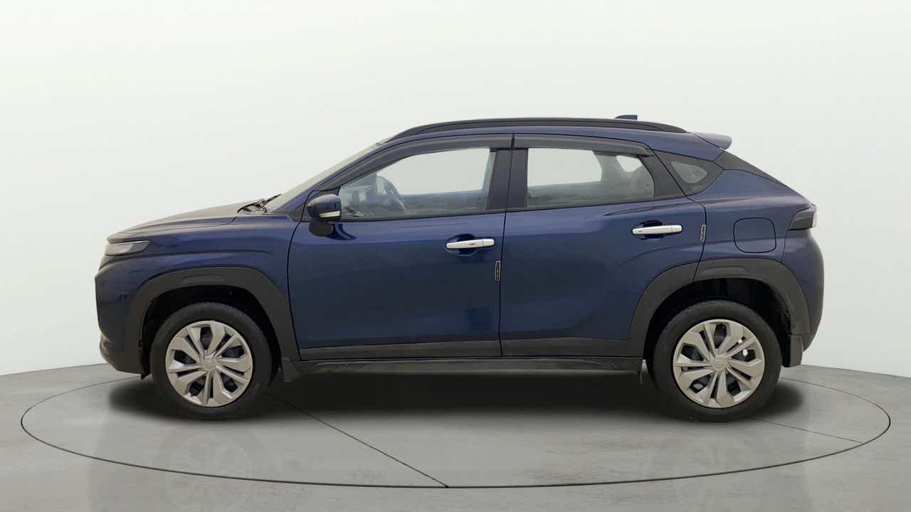 Side view of a Nexa Blue Maruti Suzuki FRONX
