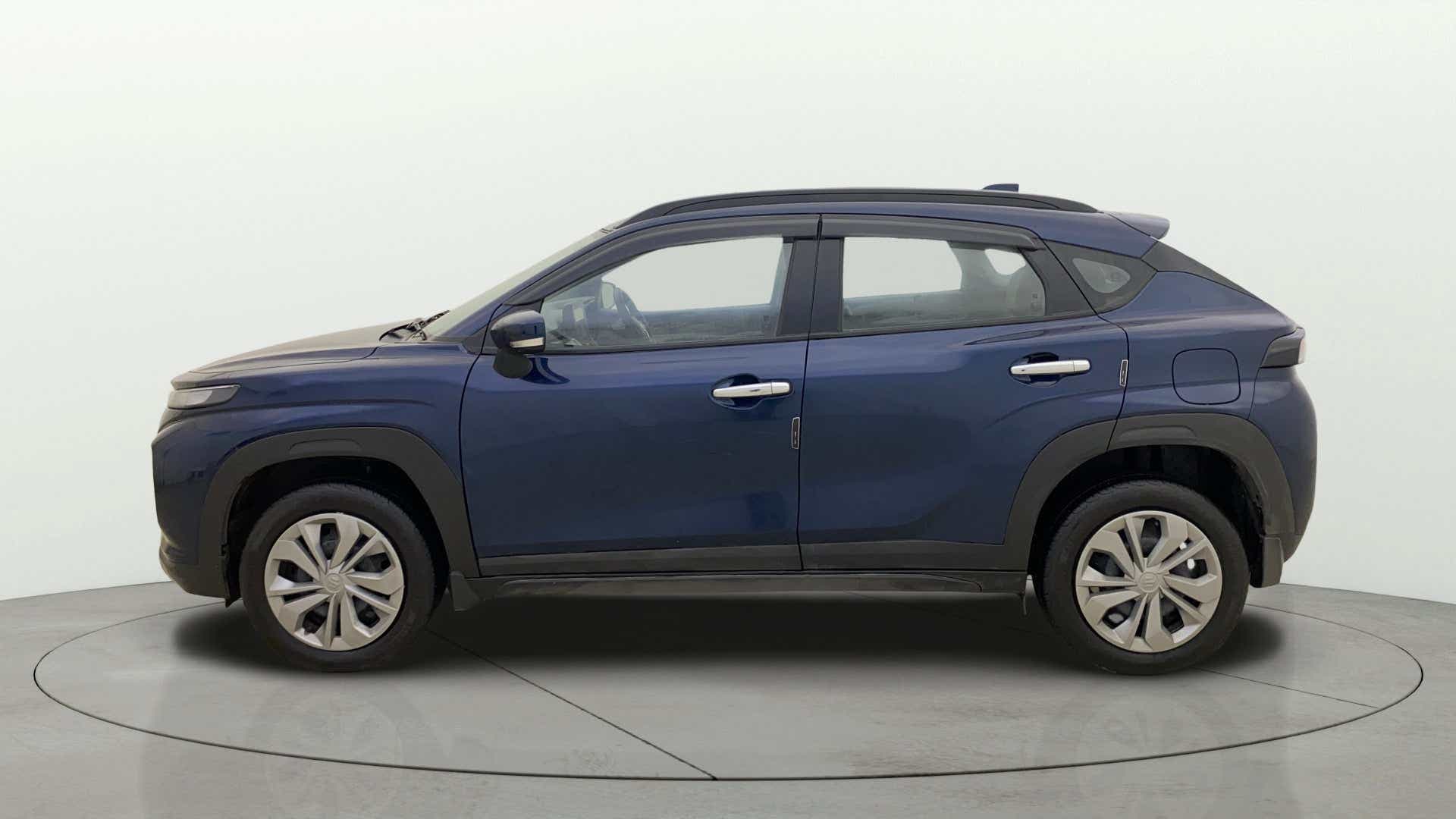 Side view of a Nexa Blue Maruti Suzuki FRONX