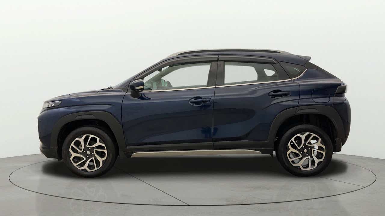 Side view of a Nexa Blue Maruti Suzuki FRONX
