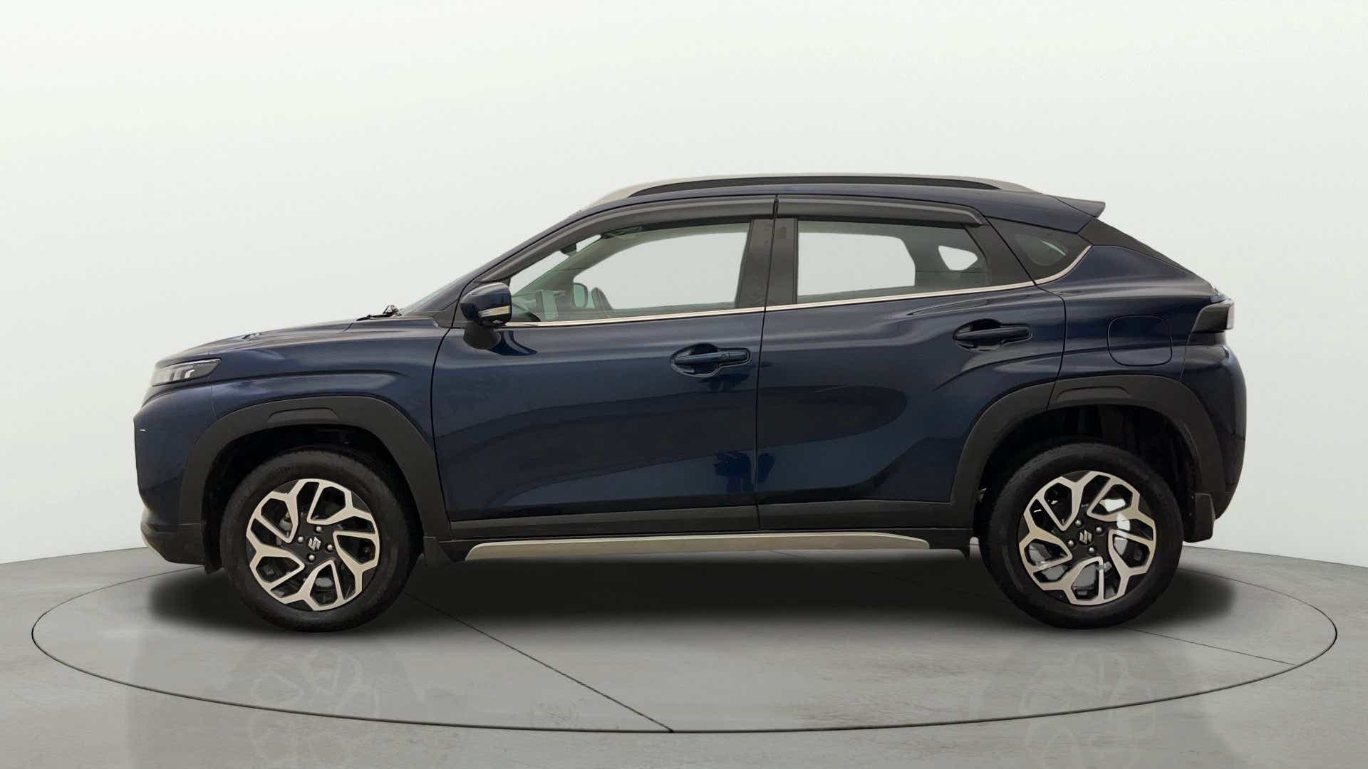 Side view of a Nexa Blue Maruti Suzuki FRONX