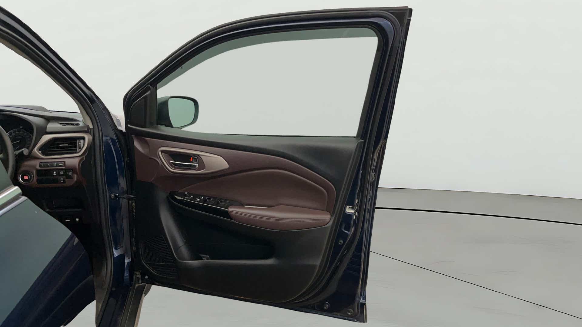 Interior driver door panel of a Maruti Suzuki FRONX