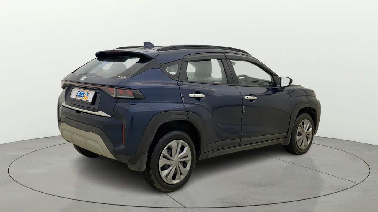 Rear three-quarter view of a Nexa Blue Maruti Suzuki FRONX