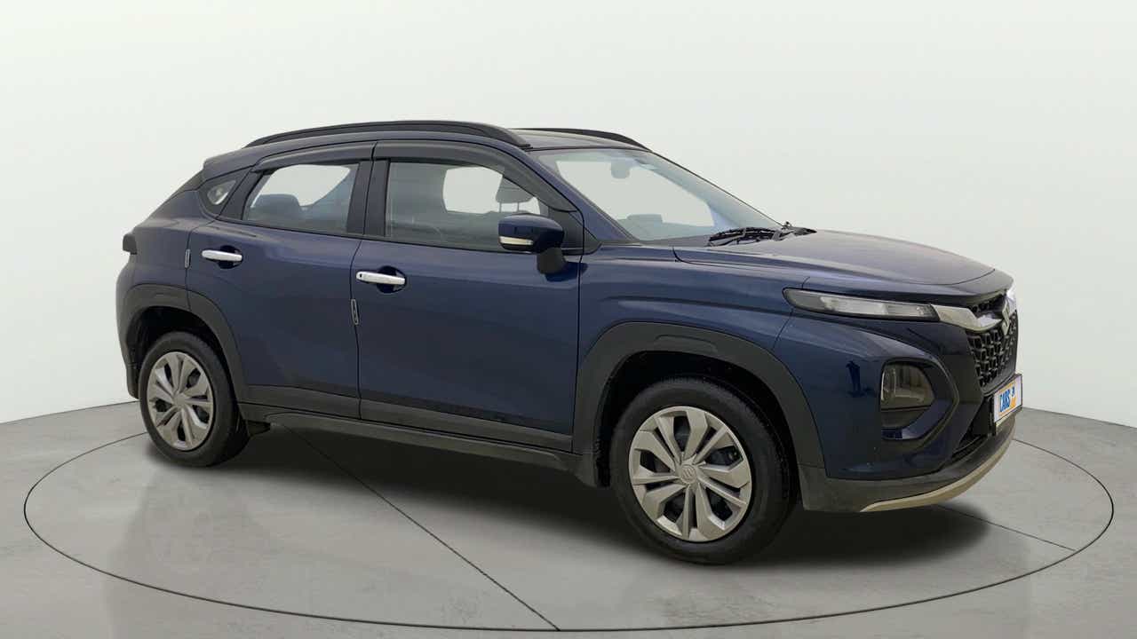 Side view of a Nexa Blue Maruti Suzuki FRONX