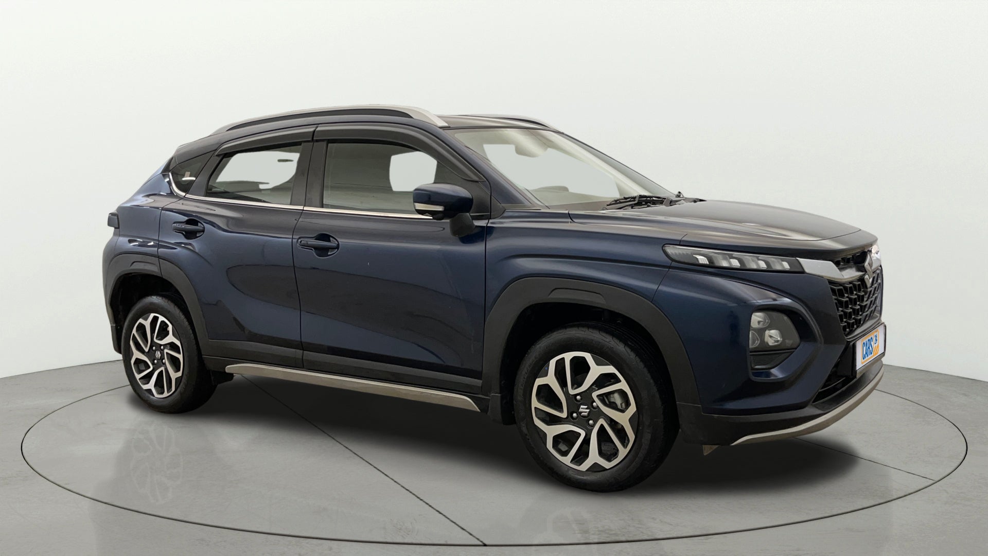 Side view of a Nexa Blue Maruti Suzuki FRONX