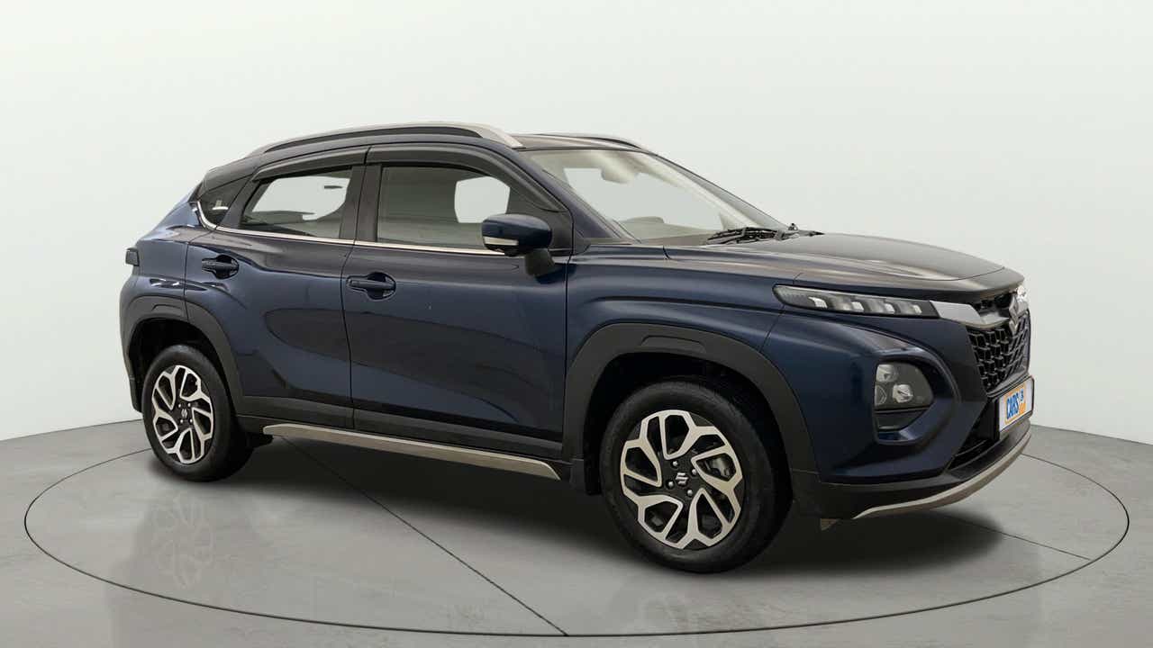 Side view of a Nexa Blue Maruti Suzuki FRONX