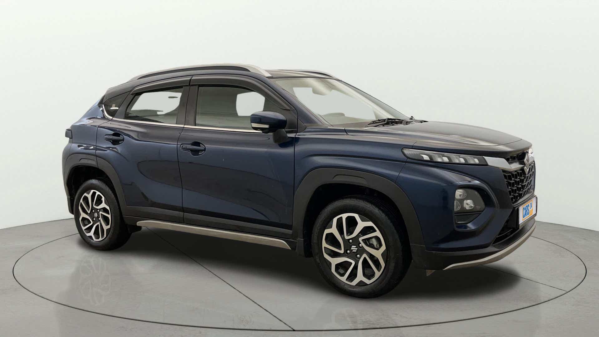 Side view of a Nexa Blue Maruti Suzuki FRONX