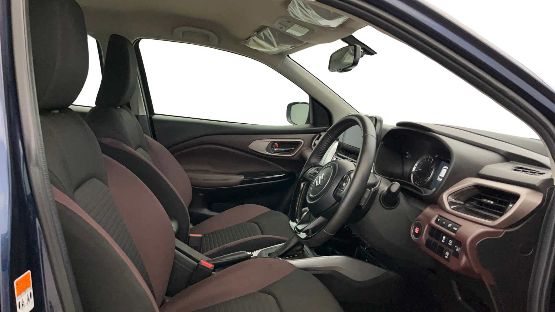 Interior front seats and dashboard of a Maruti Suzuki FRONX