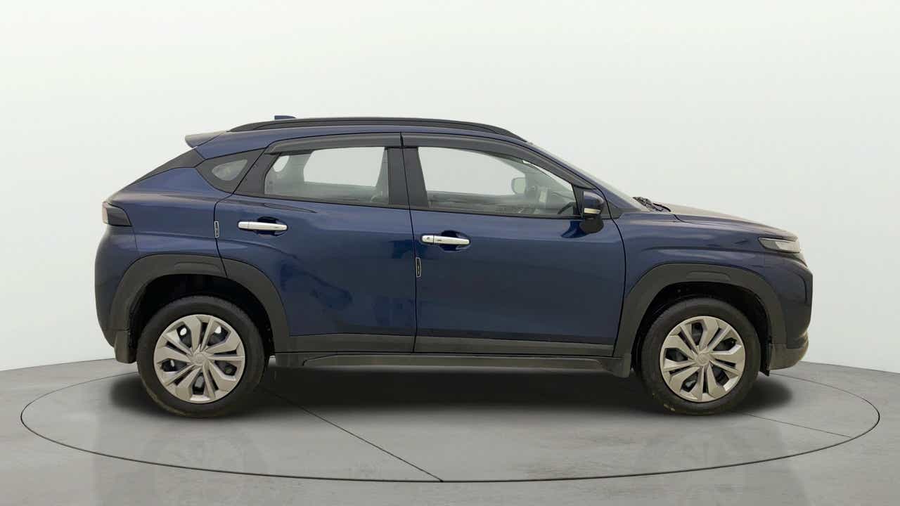 Side view of a Nexa Blue Maruti Suzuki FRONX