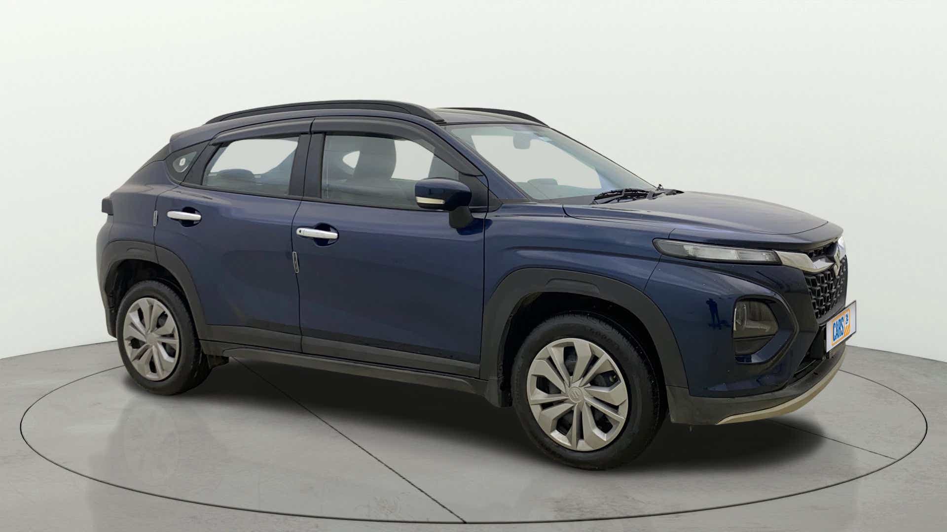 Side view of a Nexa Blue Maruti Suzuki FRONX