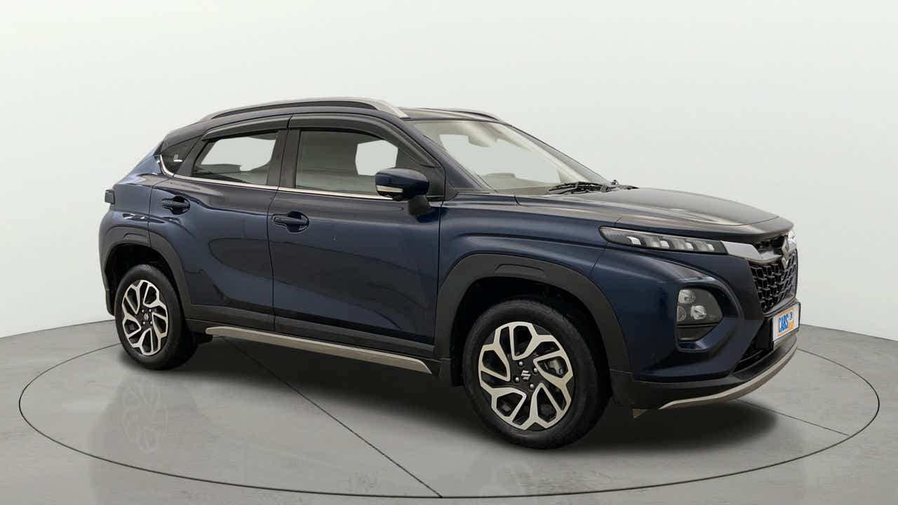 Side view of a Nexa Blue Maruti Suzuki FRONX