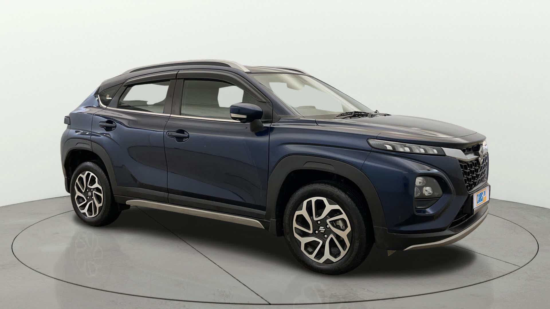 Side view of a Nexa Blue Maruti Suzuki FRONX