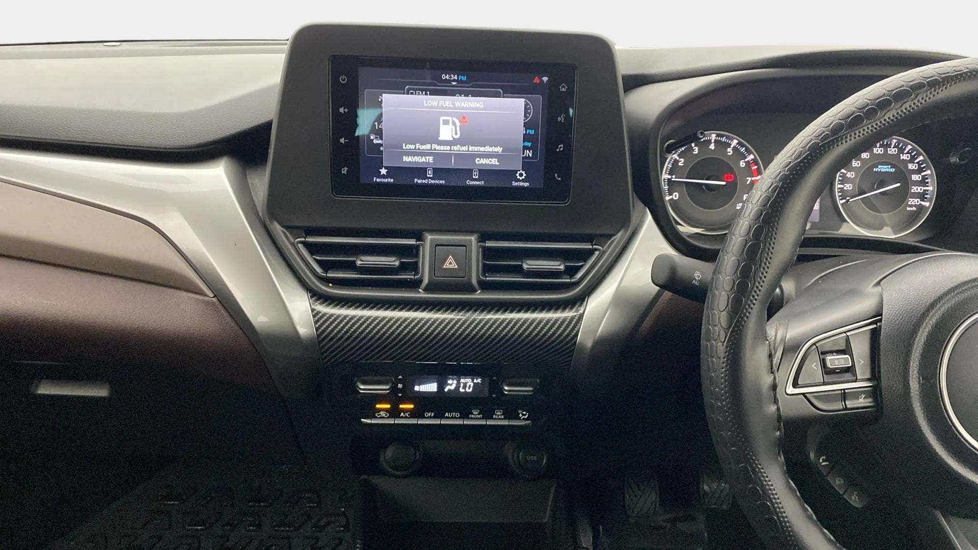 Dashboard and steering wheel of a Maruti Suzuki FRONX
