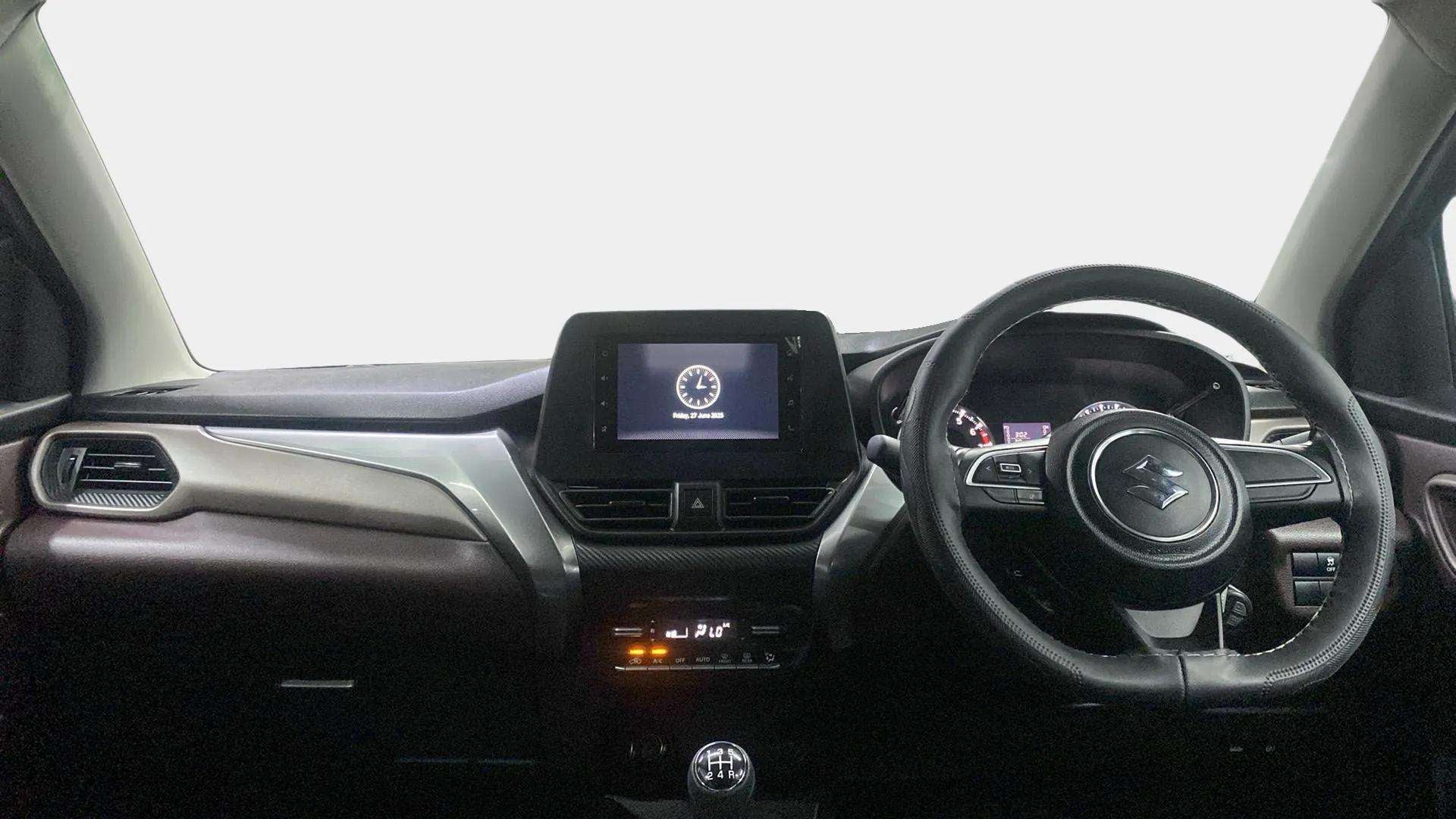 Dashboard and steering wheel view of a Maruti Suzuki FRONX