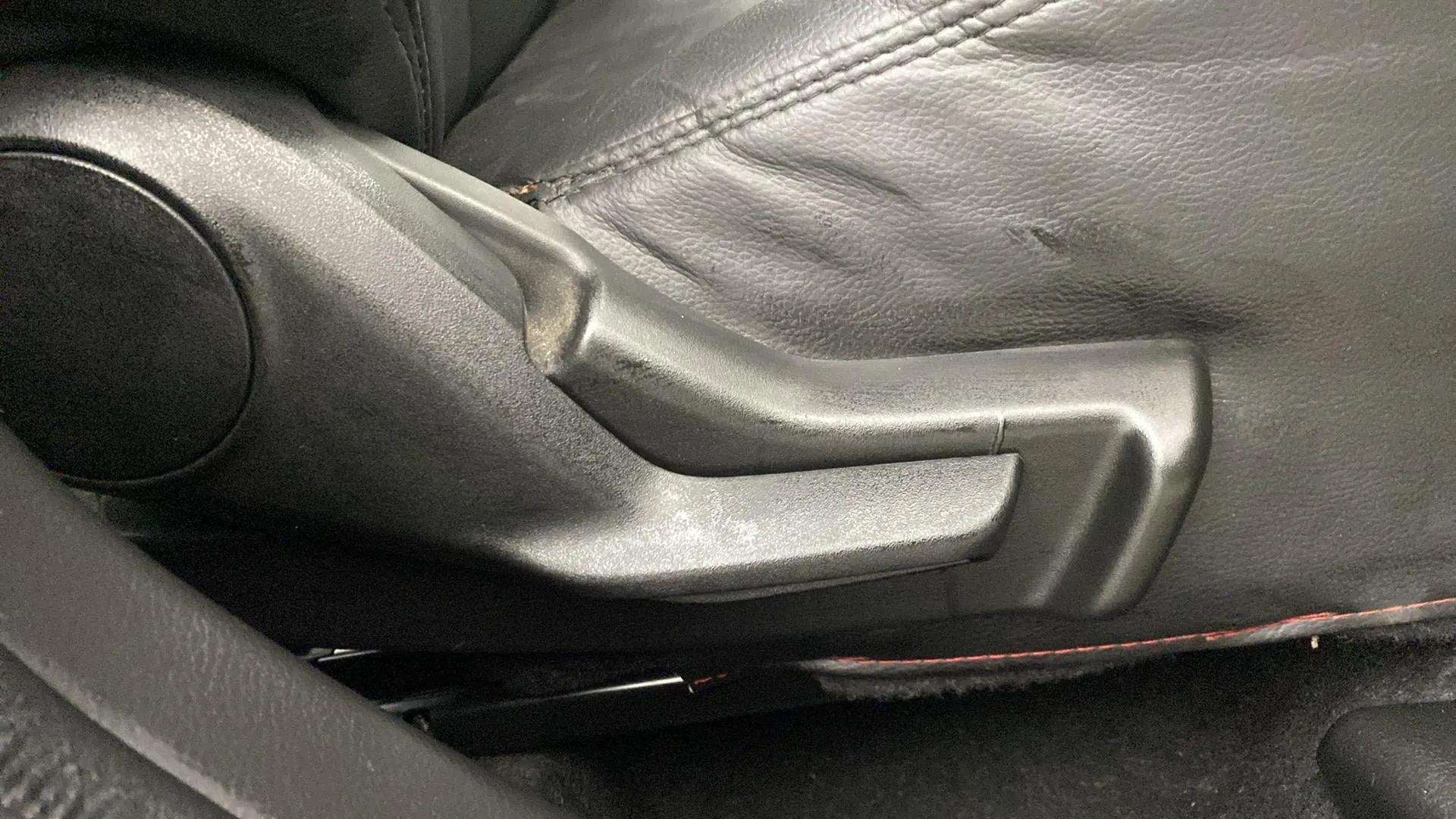 Seat adjuster handle of a Maruti Suzuki FRONX