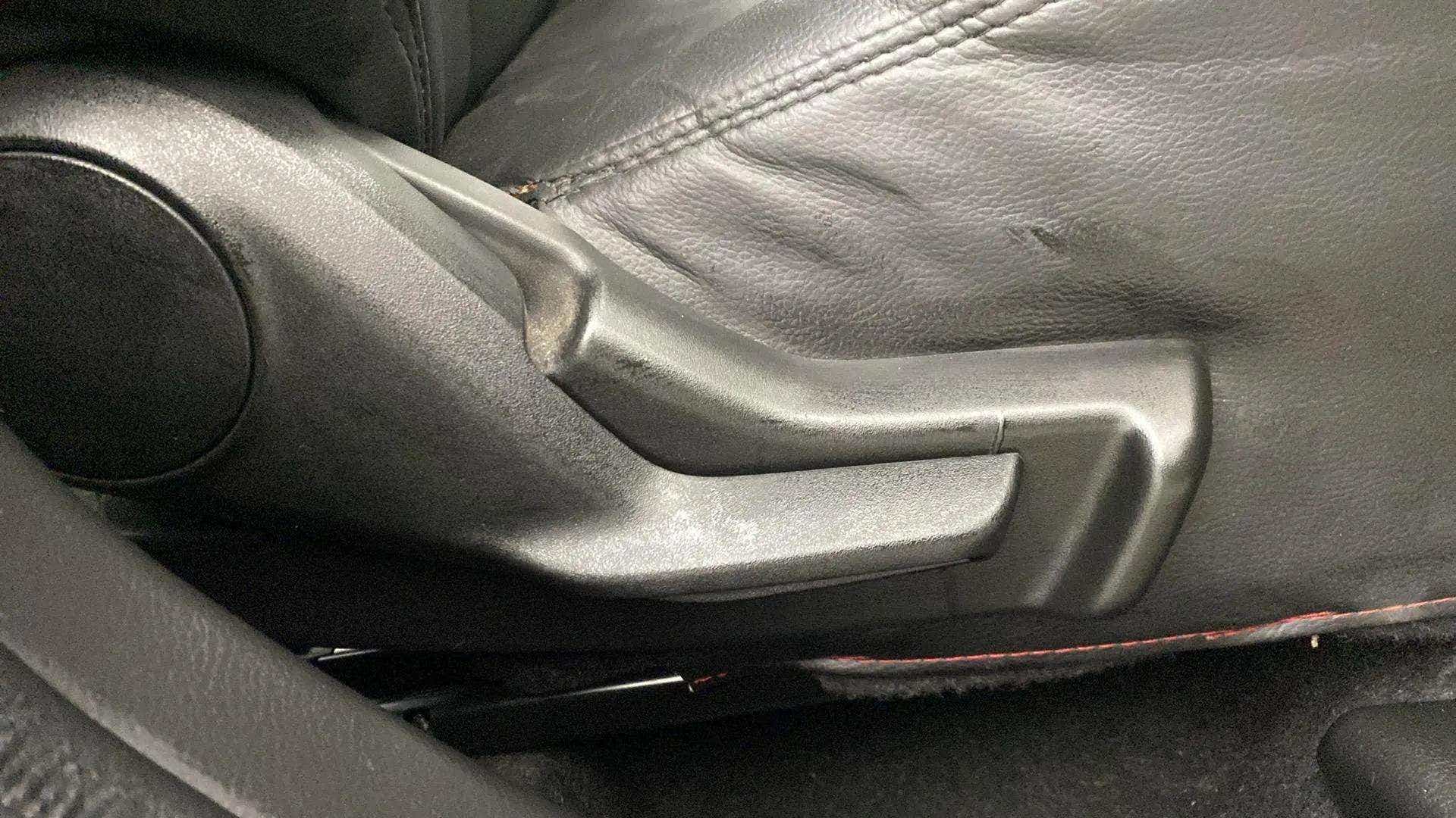 Seat adjuster handle of a Maruti Suzuki FRONX