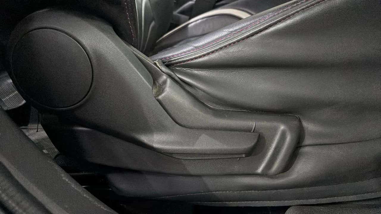 Seat adjustment lever close-up of a Maruti Suzuki FRONX