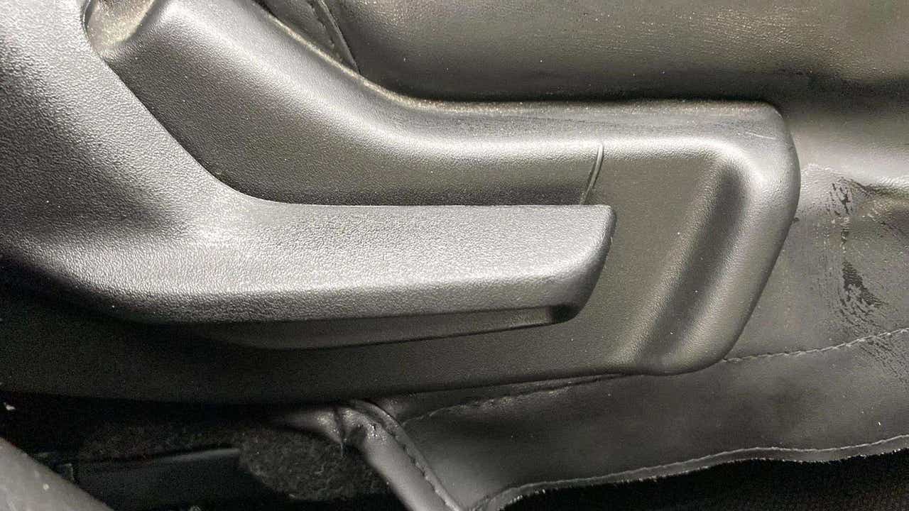 Close-up of a seat adjustment lever of a Maruti Suzuki FRONX