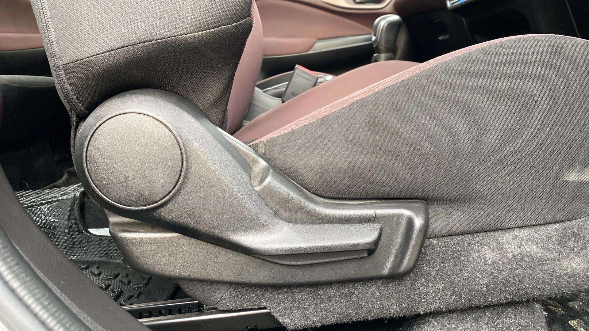 Close-up of a seat adjustment lever in a Maruti Suzuki FRONX