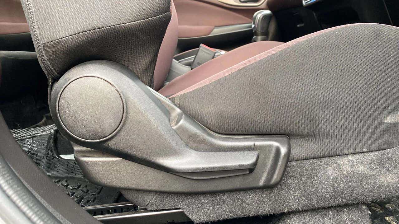 Close-up of a seat adjustment lever in a Maruti Suzuki FRONX