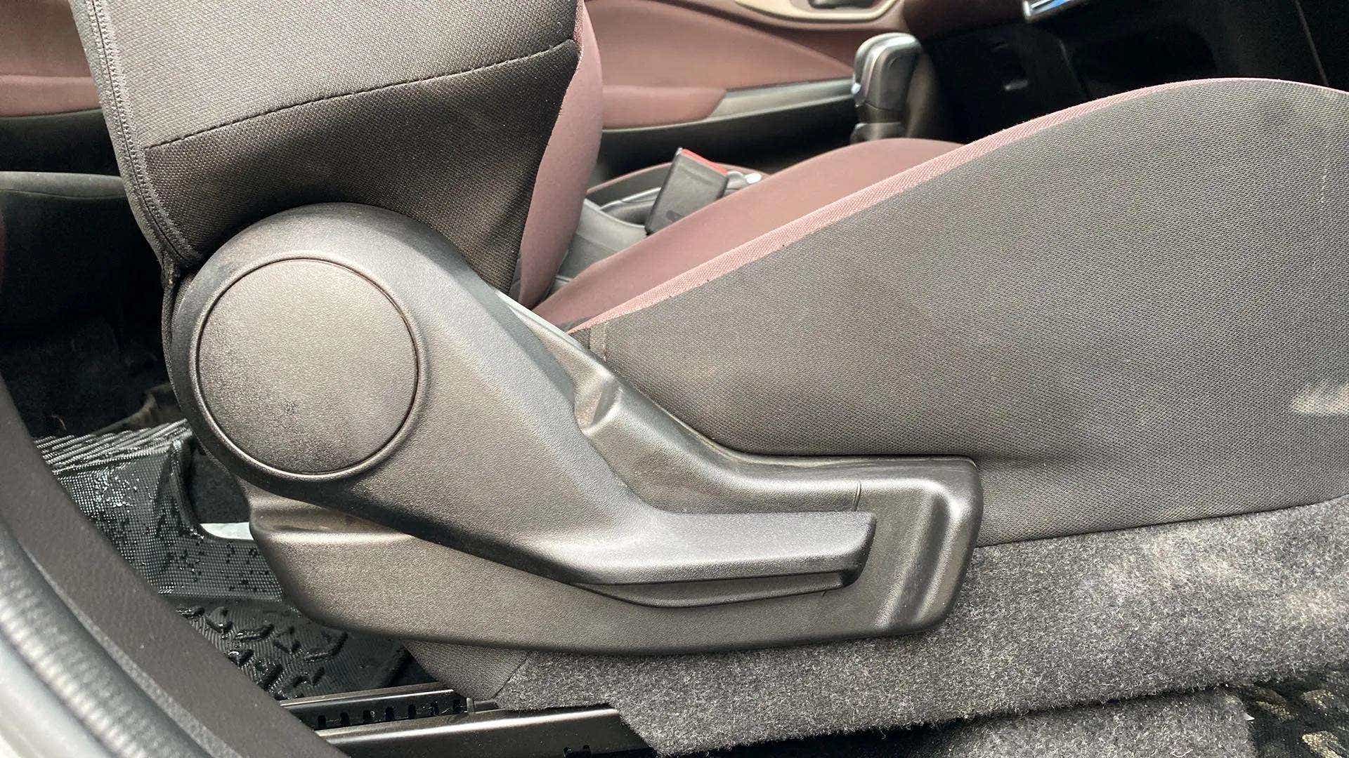 Close-up of a seat adjustment lever in a Maruti Suzuki FRONX