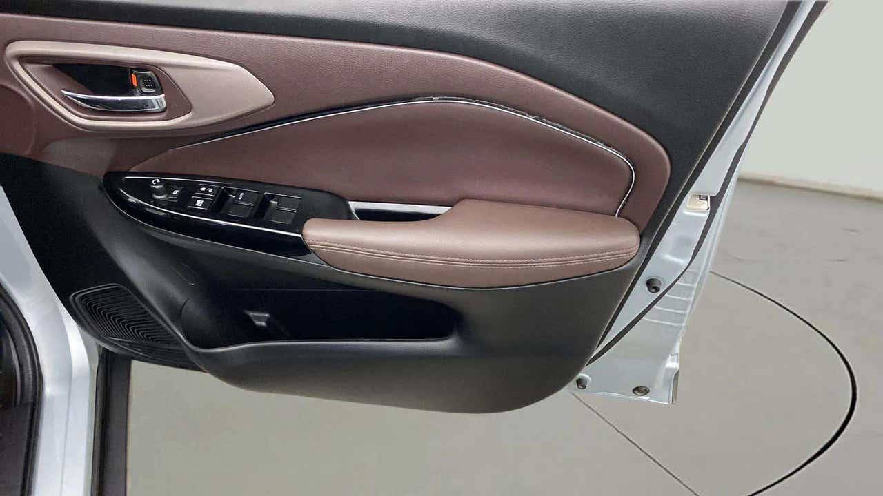 Front interior door panel of a Maruti Suzuki FRONX