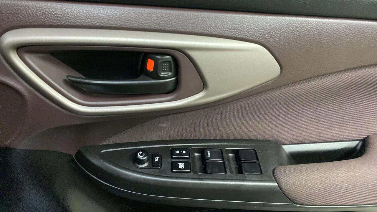 Front driver door controls of a Maruti Suzuki FRONX