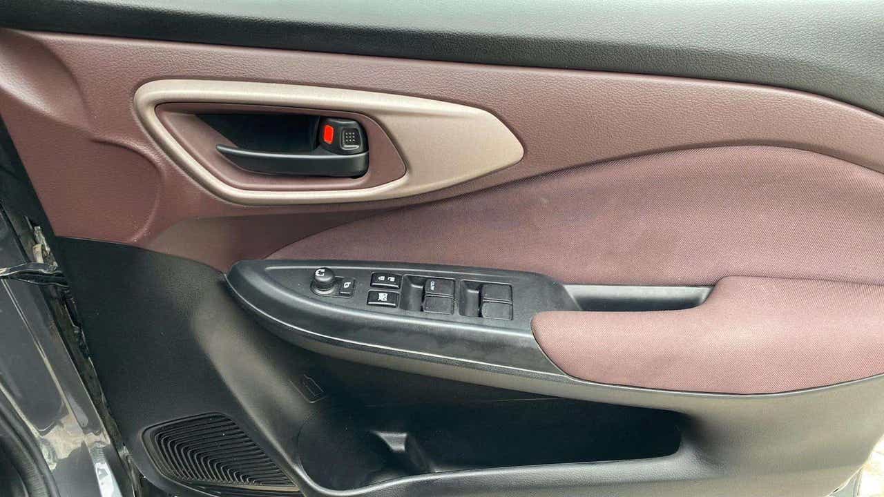 Interior driver-side door panel of a Maruti Suzuki FRONX