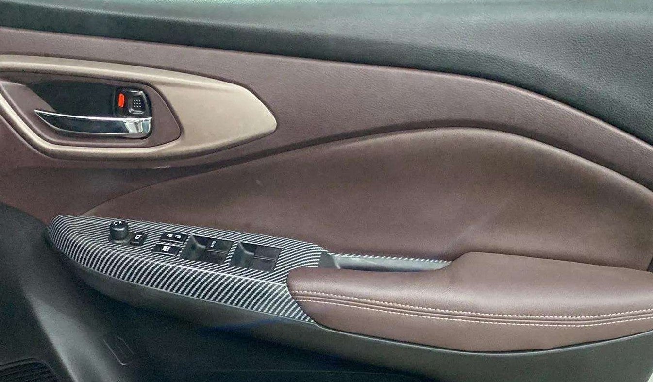 Interior door panel view of a Maruti Suzuki FRONX