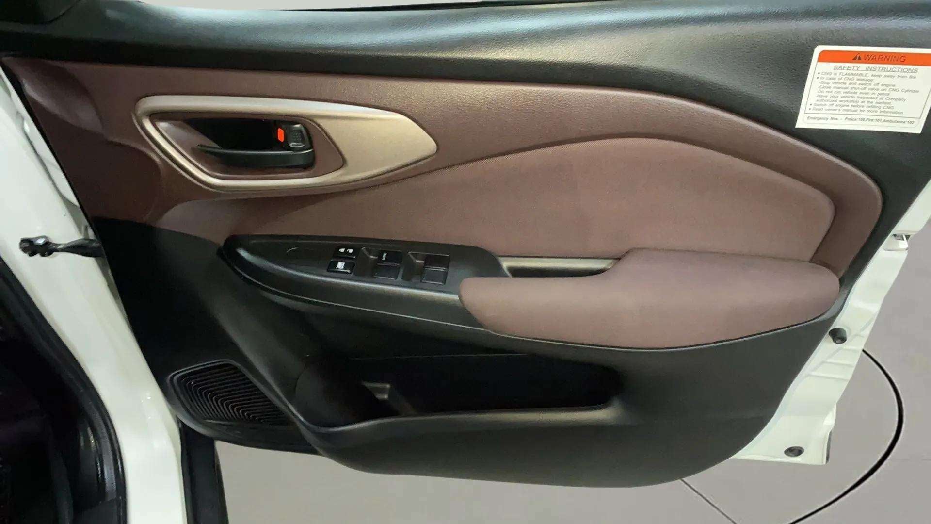 Front interior door panel of a Maruti Suzuki FRONX