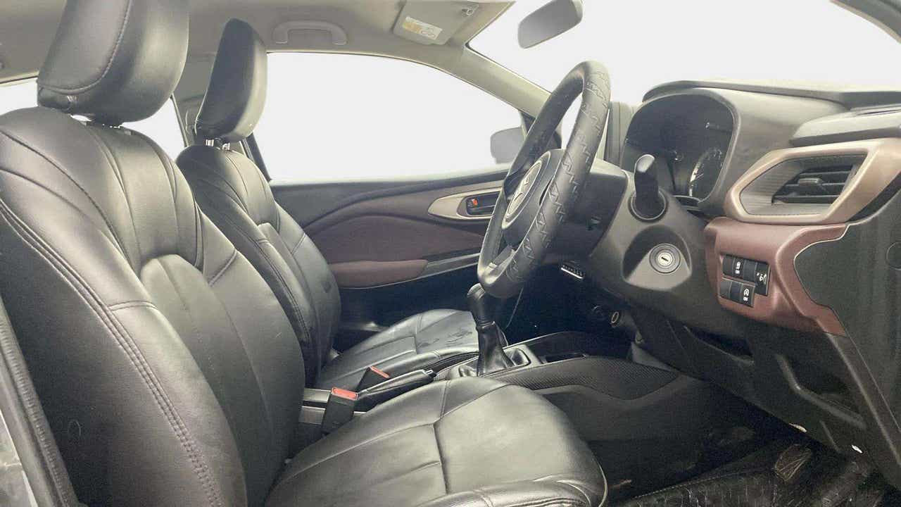 Interior front seats and dashboard of a Maruti Suzuki FRONX