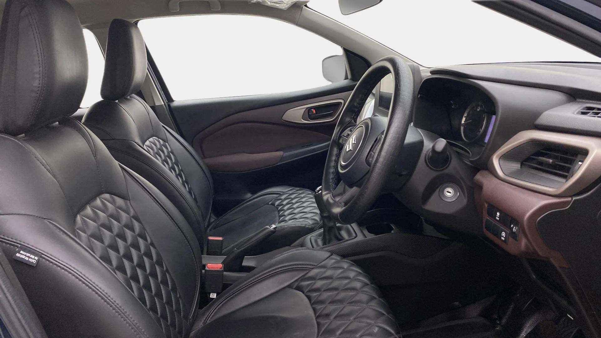 Interior front seats and dashboard of a Maruti Suzuki FRONX